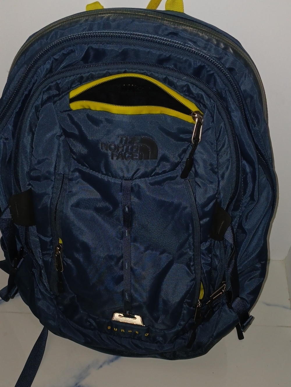 The North Face Navy Blue Backpack with Yellow Accents